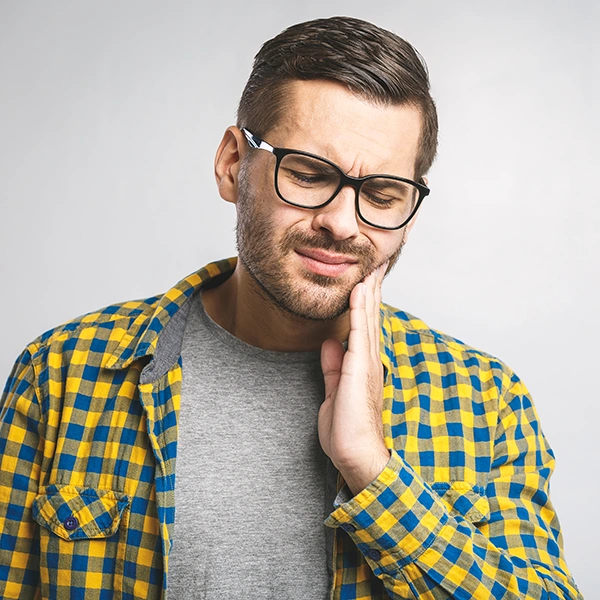 A young man with jaw discomfort